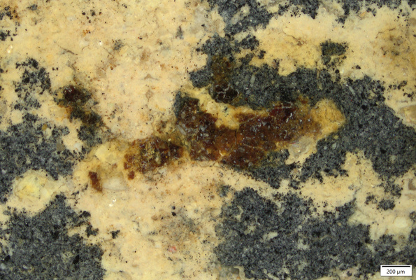 002 dark red crust residue over yellow coating.tif
